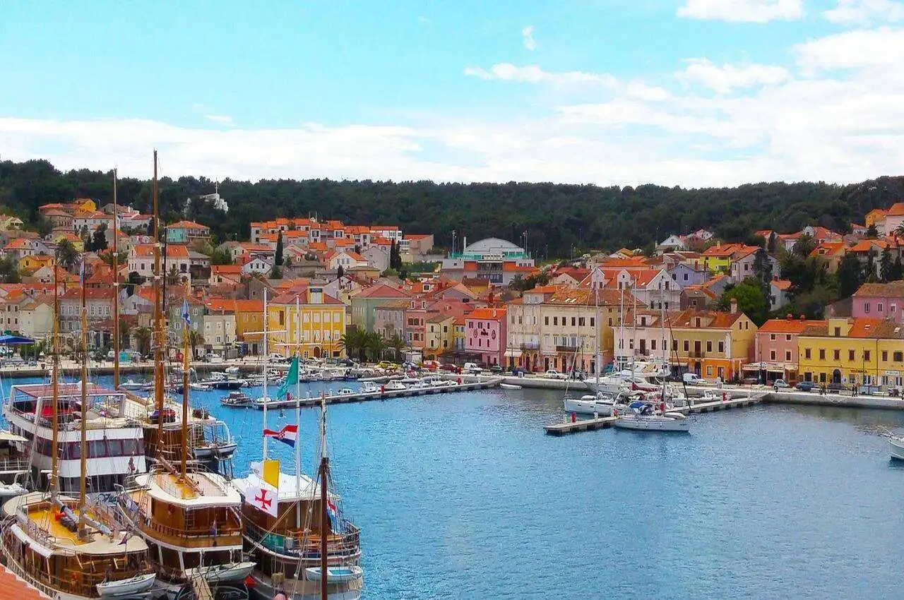 Coastal side in Losinj, ferries and a neighborhood