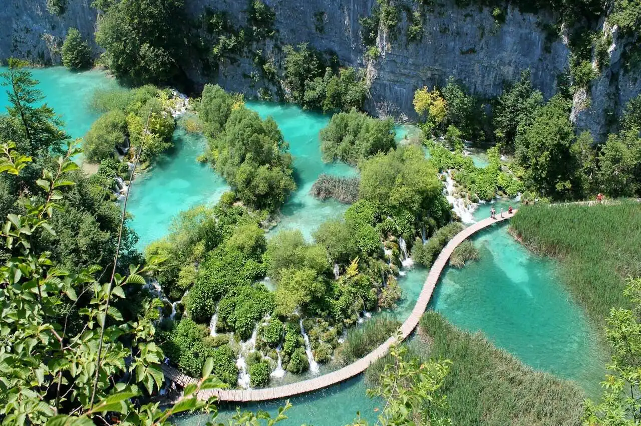 Bluish water and greenry all around in Plitvice Lake National Park