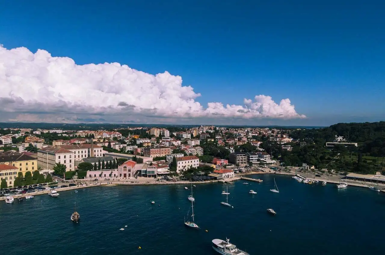 Boats in the sea and houses on the seaside in Rovinj