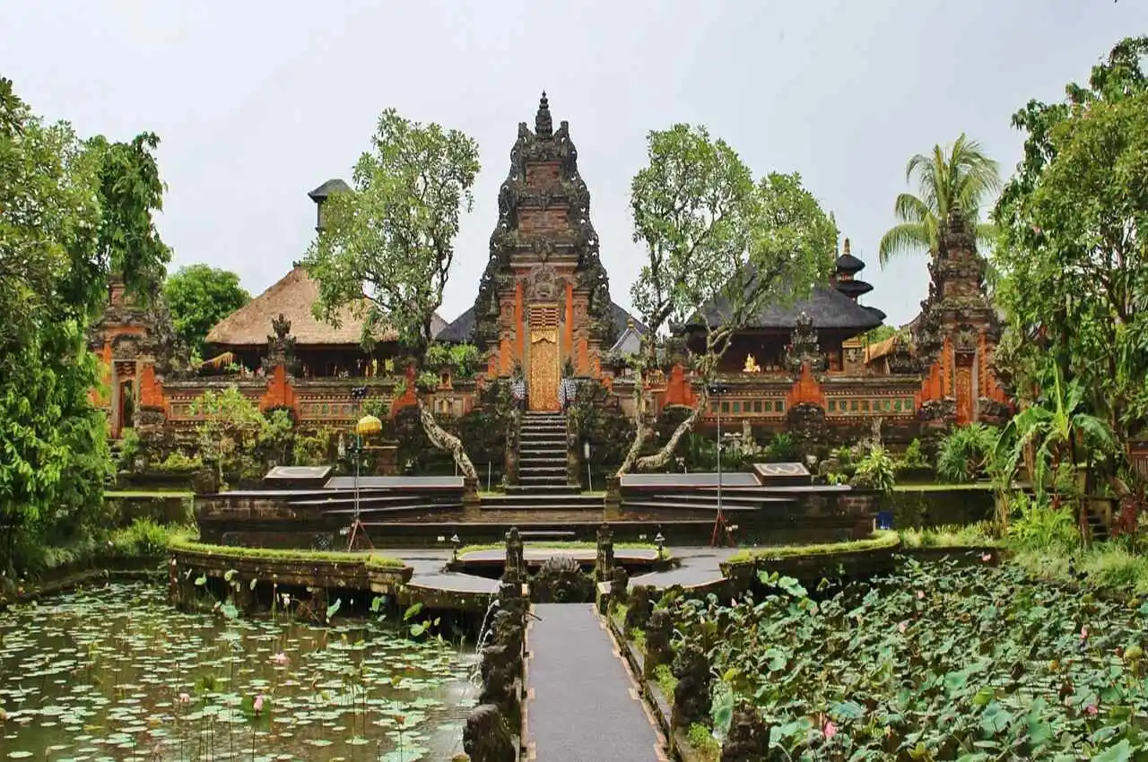 a temple with greenery all around it. 