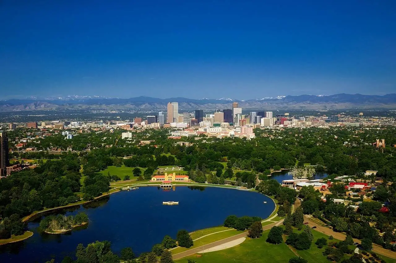 Lake with greenery and views of a neighborhood in Denver  - among cheap Places for Solo Female Travelers in the USA