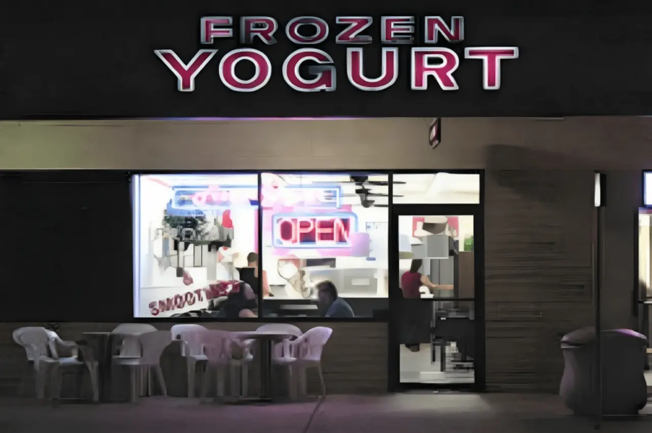 Frozen Yogurt banner with chairs outside.