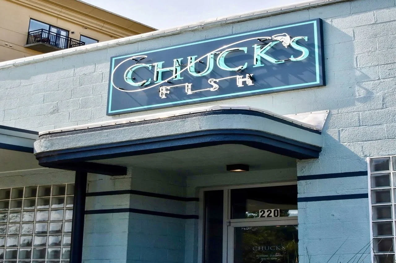 Entrance to Chuck’s Fish restaurant with a banner on top.