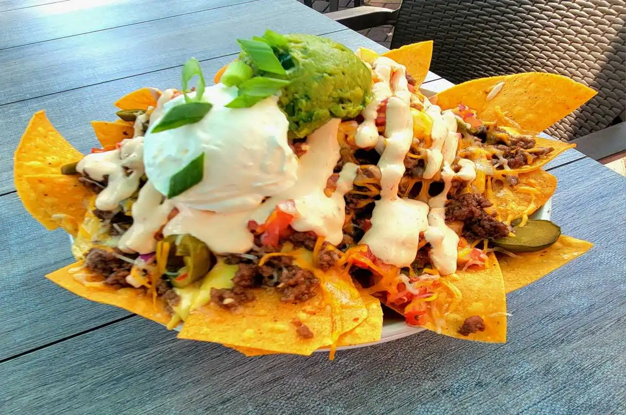 A plate full of nachos,