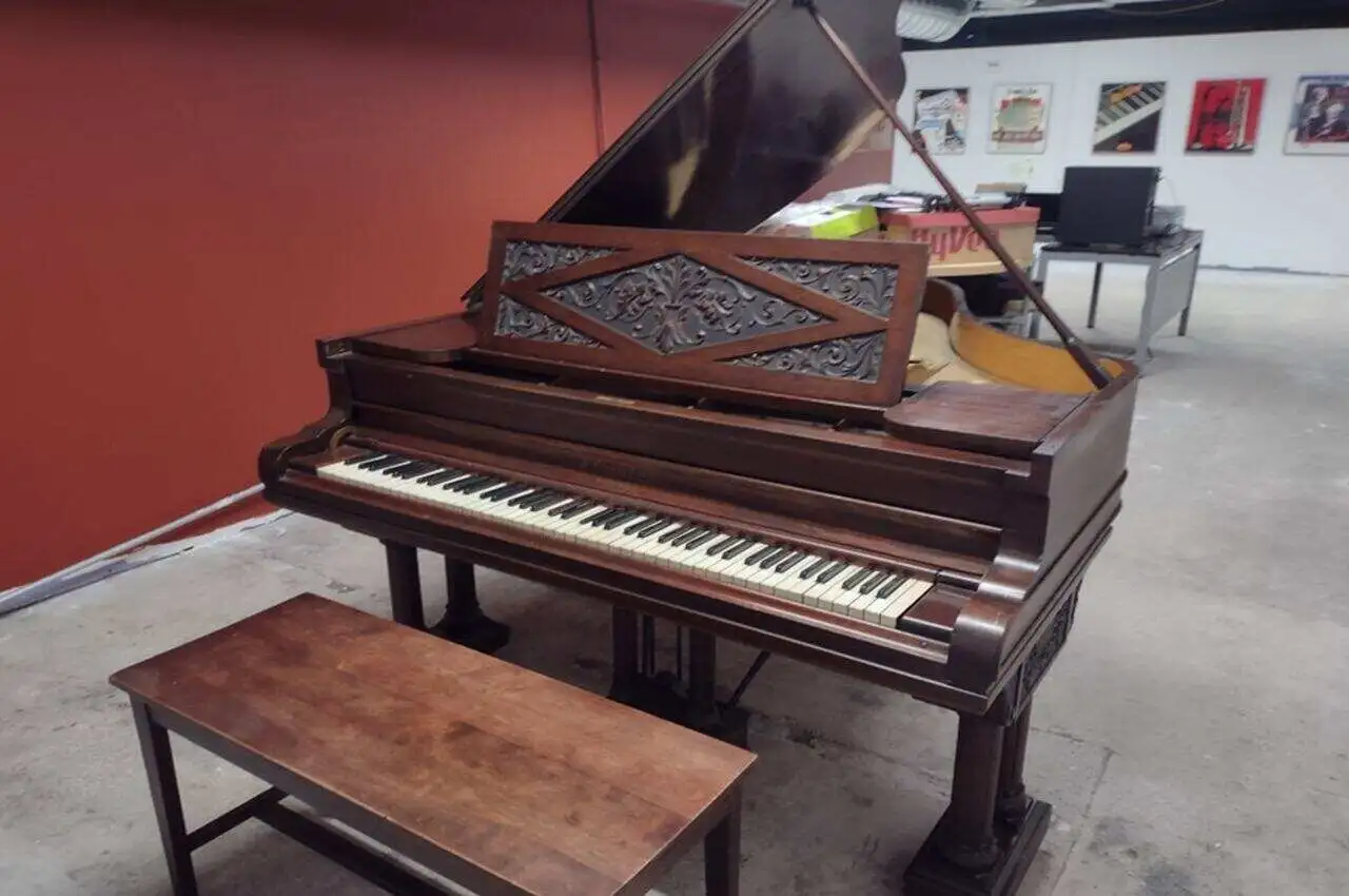 A piano in a gallery.