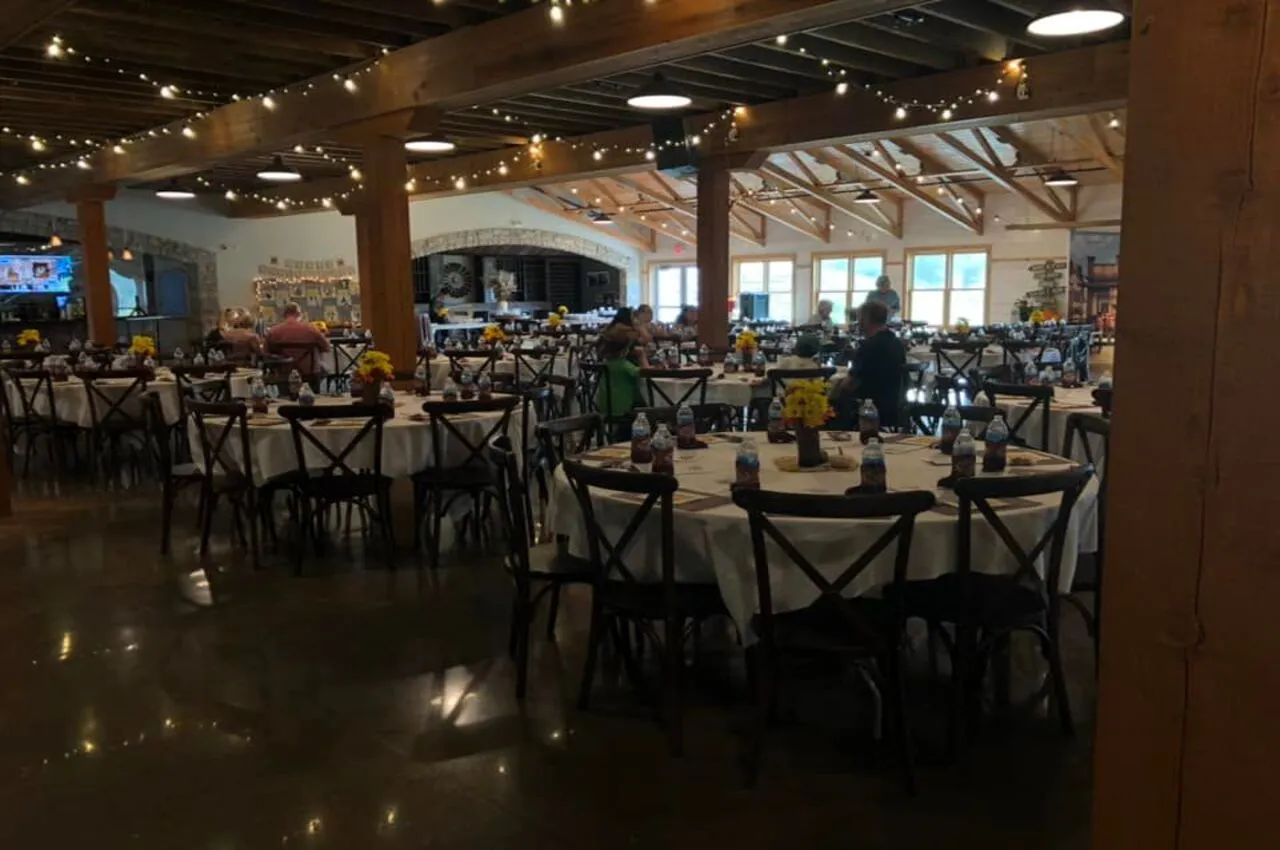 Seating area with different people eating food.