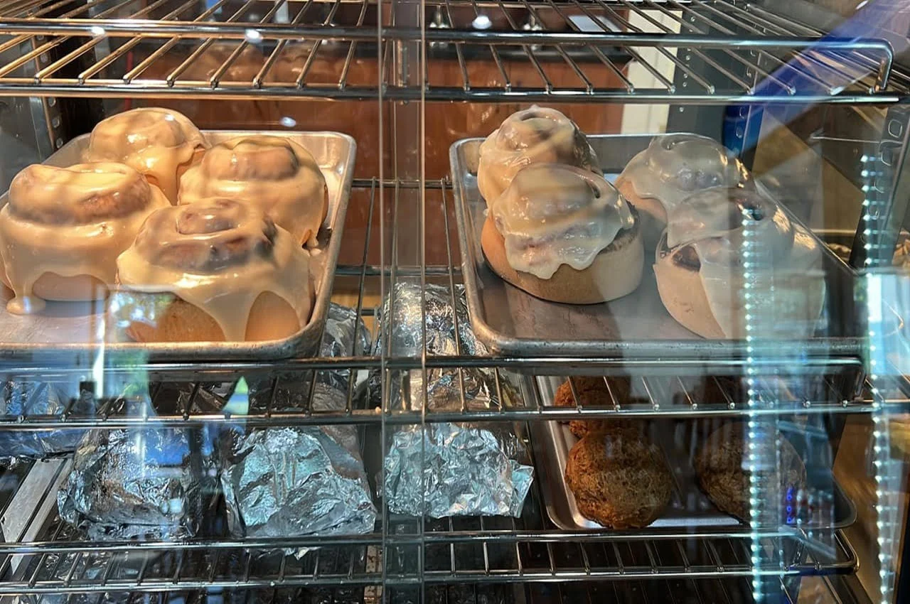 Different baked items on display in a bakery.