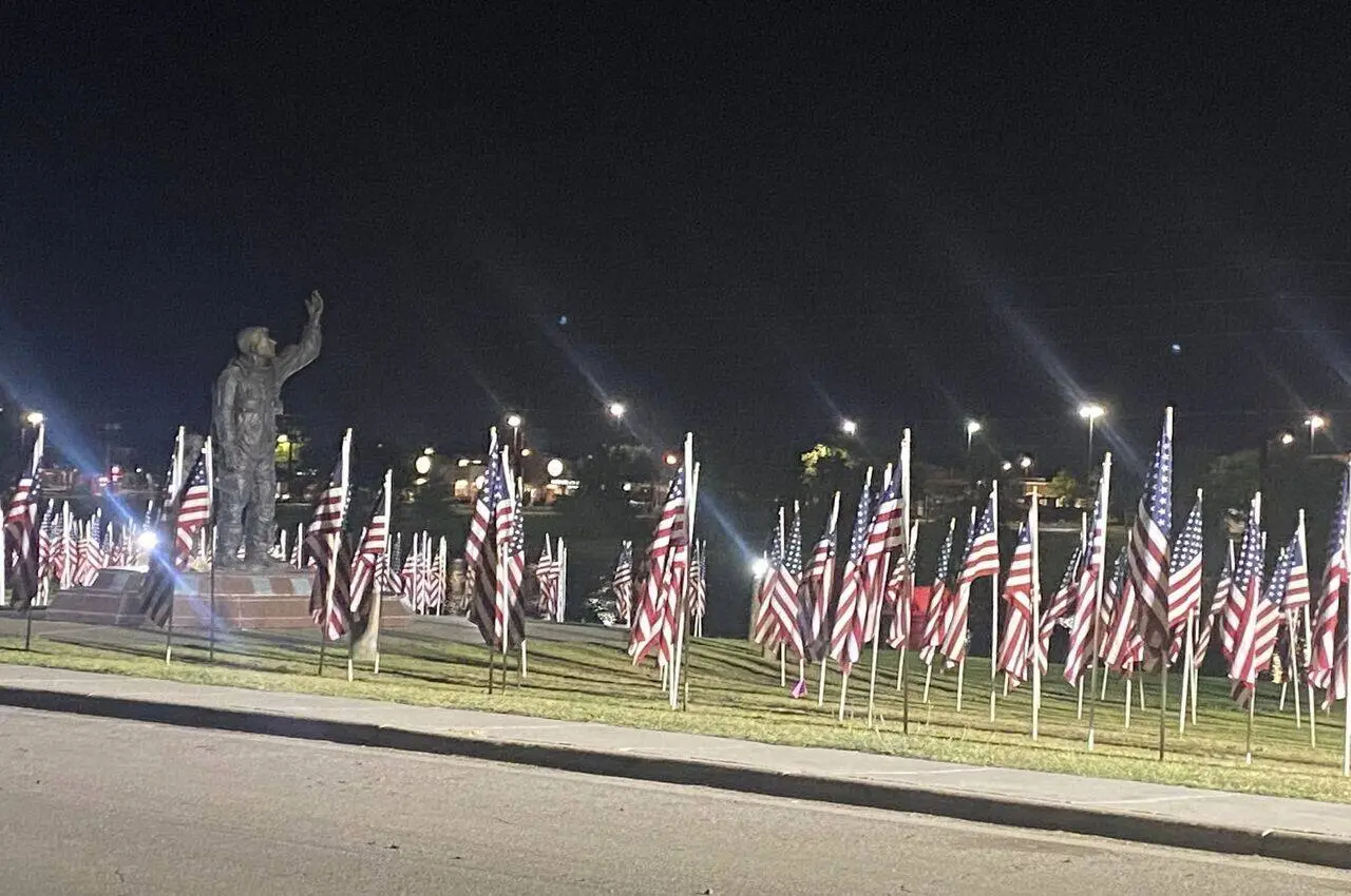 American flags and a statue.