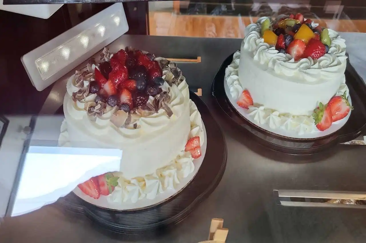 Cake on display in a bakery.