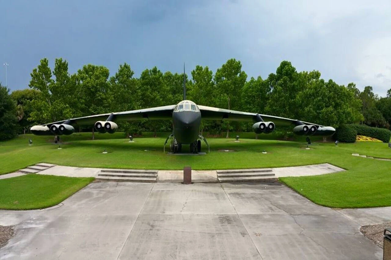 a large airplane on a grass field. Among hidden gems in Orlando