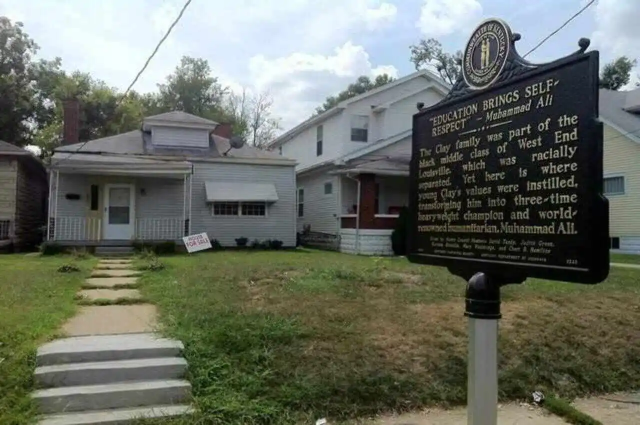 a sign in front of a house