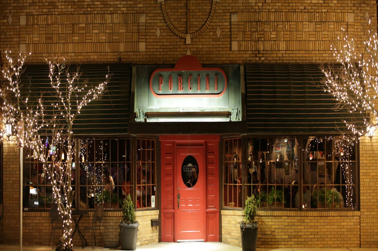 a building with a red door and a sign