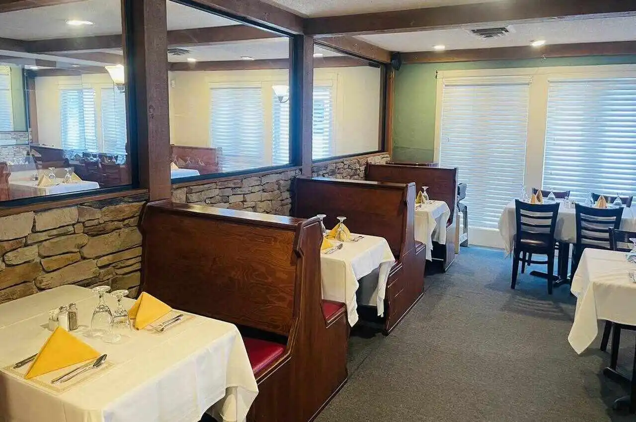 a restaurant with tables and chairs