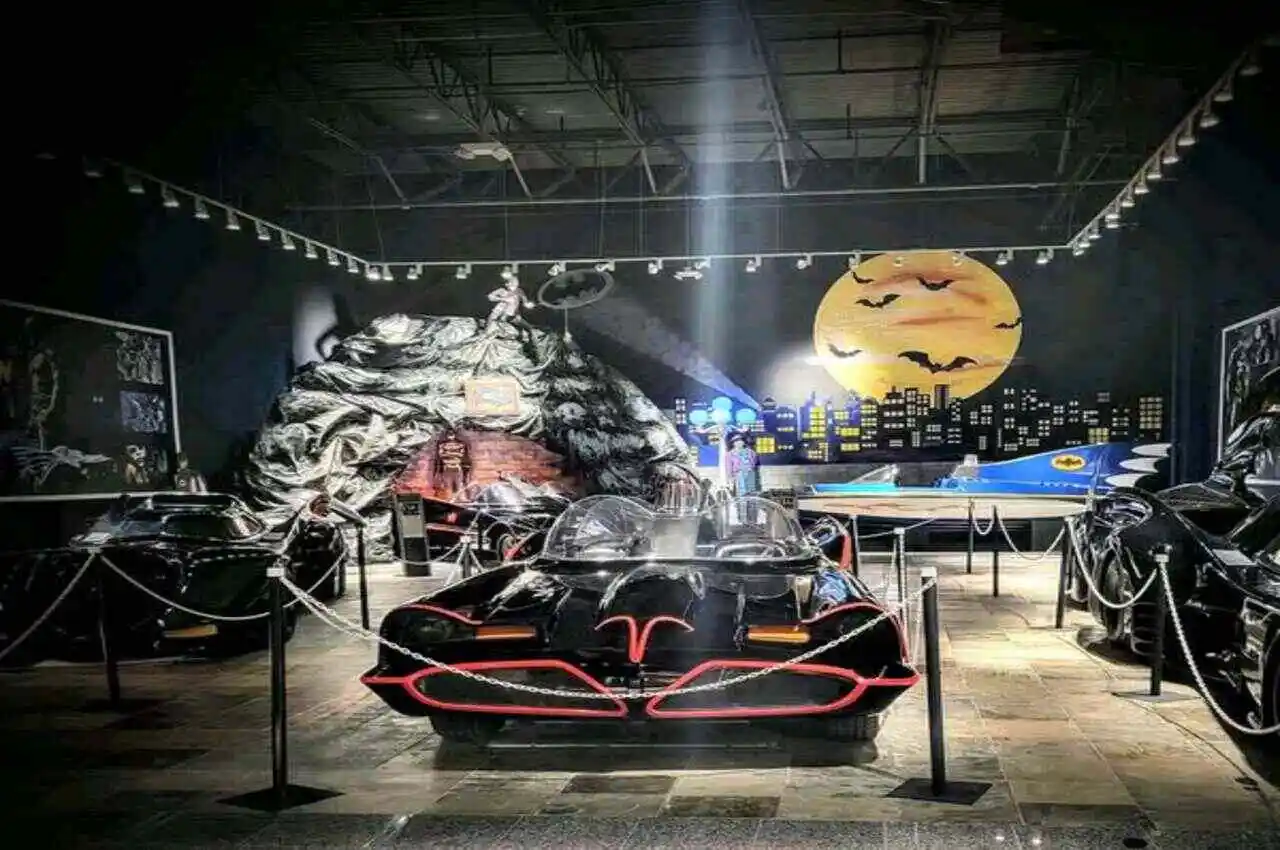 a batmobile in a dark room