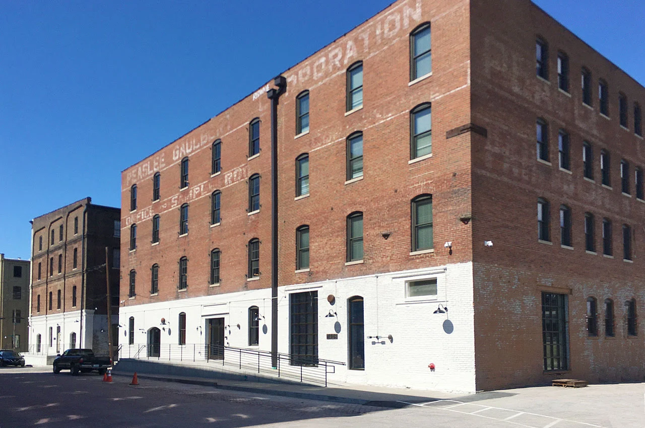 a brick building with a white wall