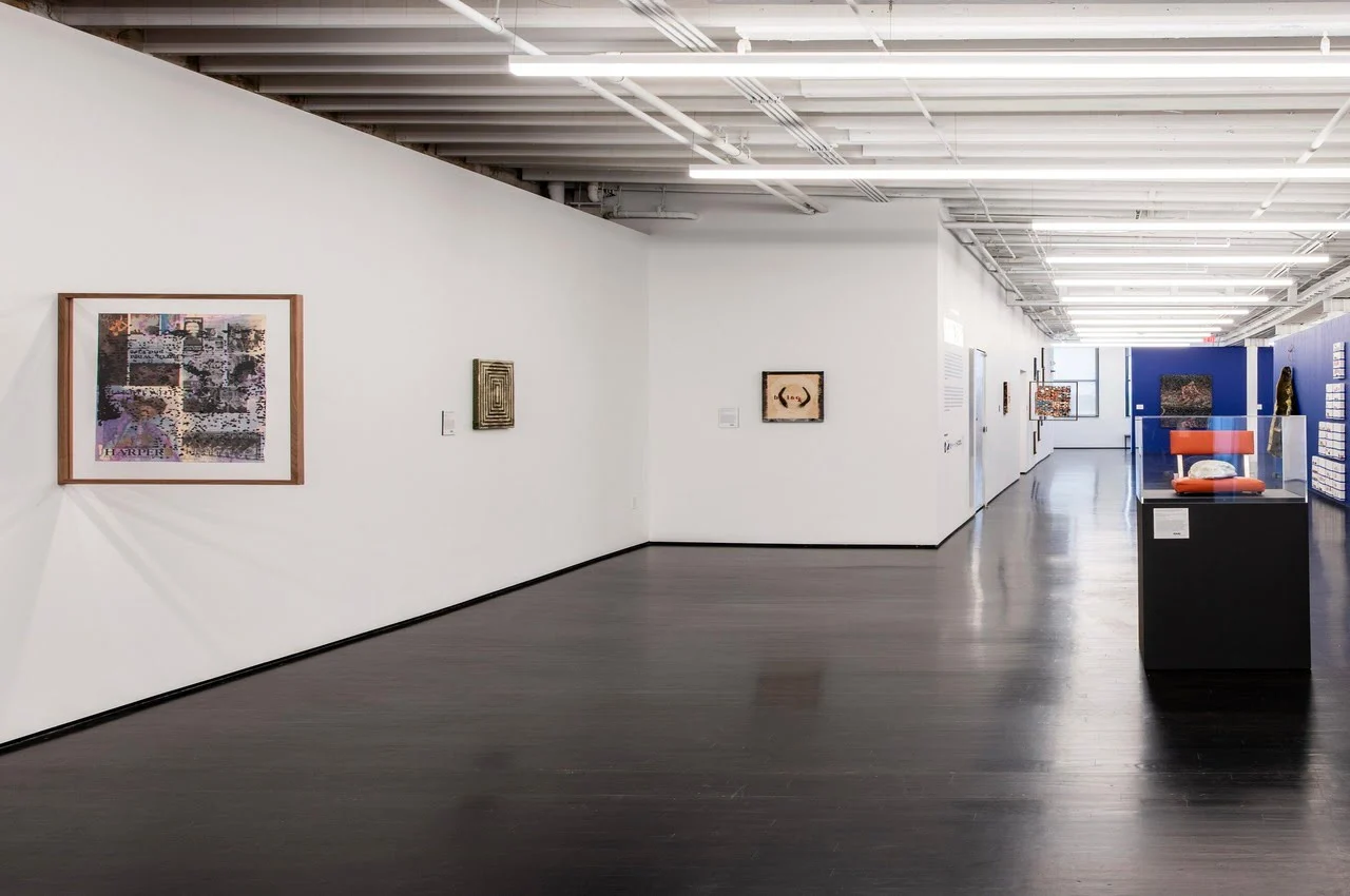 a room with white walls and black floor