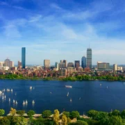 Boats in the water with the Boston skyline on the back - a stunning hidden gem in Boston.