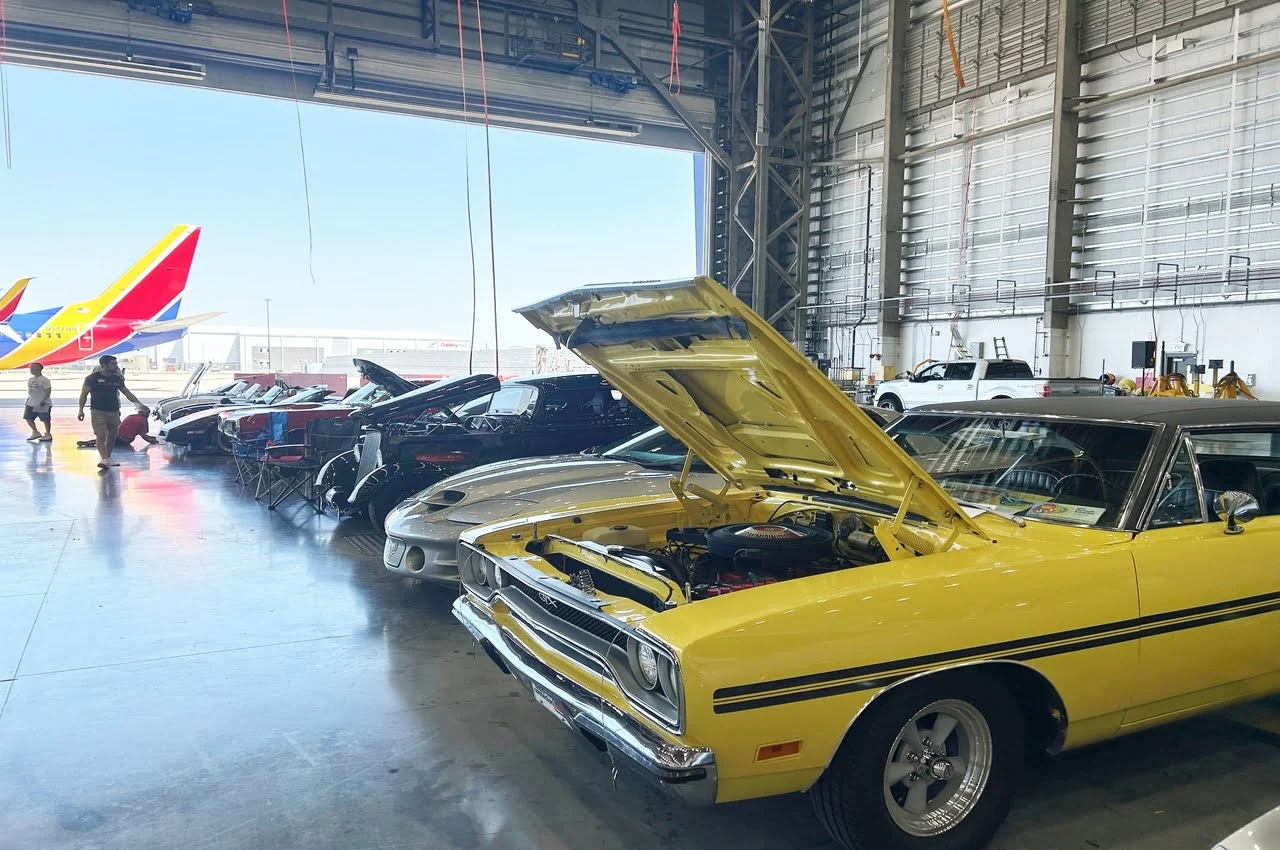Vintage cars standing in line.
