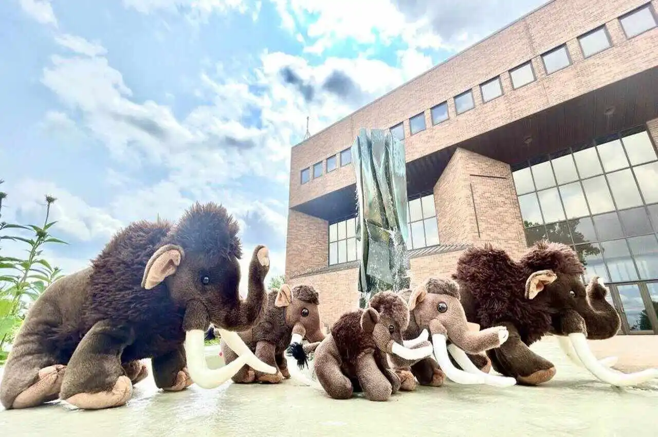 Toy woolly mammoth with building on the back