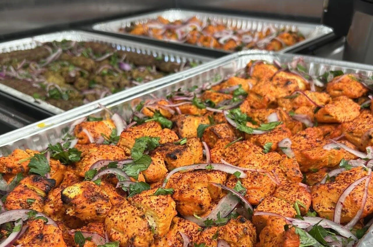 Kabobs in a container.