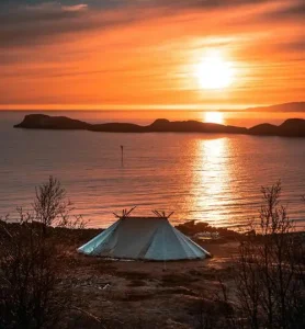 Tent in front of a river - a stunning spot for tourists